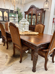 Carved dining table & 6 chairs