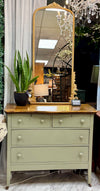 Vintage 4-drawer sage green chest on casters