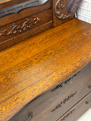 Antique dark oak dresser on casters w/mirror