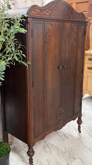 Antique cedar-lined chifferobe on casters