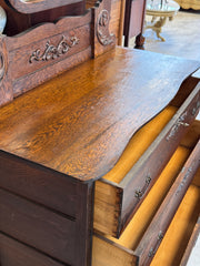 Antique dark oak dresser on casters w/mirror
