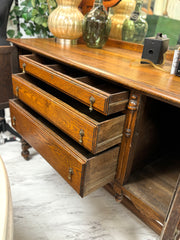 Antique sideboard/buffet w/mirrored back on casters