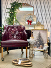 Tufted burgundy chair on casters ￼