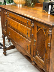 Antique sideboard/buffet w/mirrored back on casters