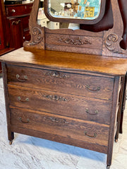 Antique dark oak dresser on casters w/mirror