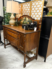 Antique sideboard/buffet w/mirrored back on casters