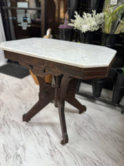 Antique table w/marble top on casters