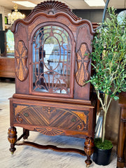 Antique Jacobean China cabinet on casters