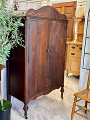 Antique cedar-lined chifferobe on casters