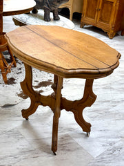 Antique wood side table on casters