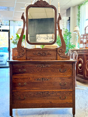 Antique dark oak dresser on casters w/mirror