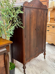 Antique cedar-lined chifferobe on casters