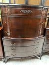 Antique mahogany serpentine chest on chest