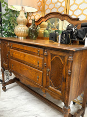 Antique sideboard/buffet w/mirrored back on casters