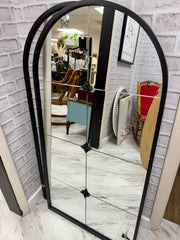 Black arch mirror w/filigree design