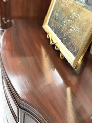 Antique mahogany serpentine chest on chest