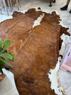 XL brown/white cowhide rug