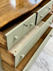 Vintage 4-drawer sage green chest on casters